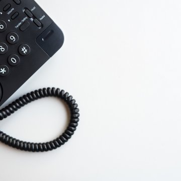 AXVoice voip service black voip phone white background